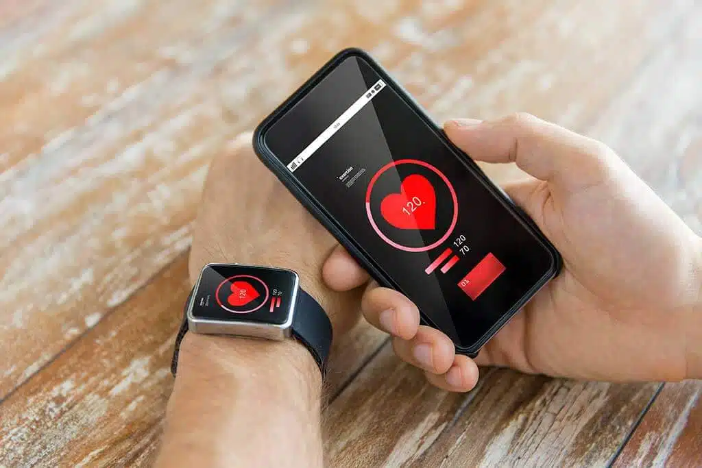 An individual using a smartphone to track menstrual cycles, highlighting digital health tracking.